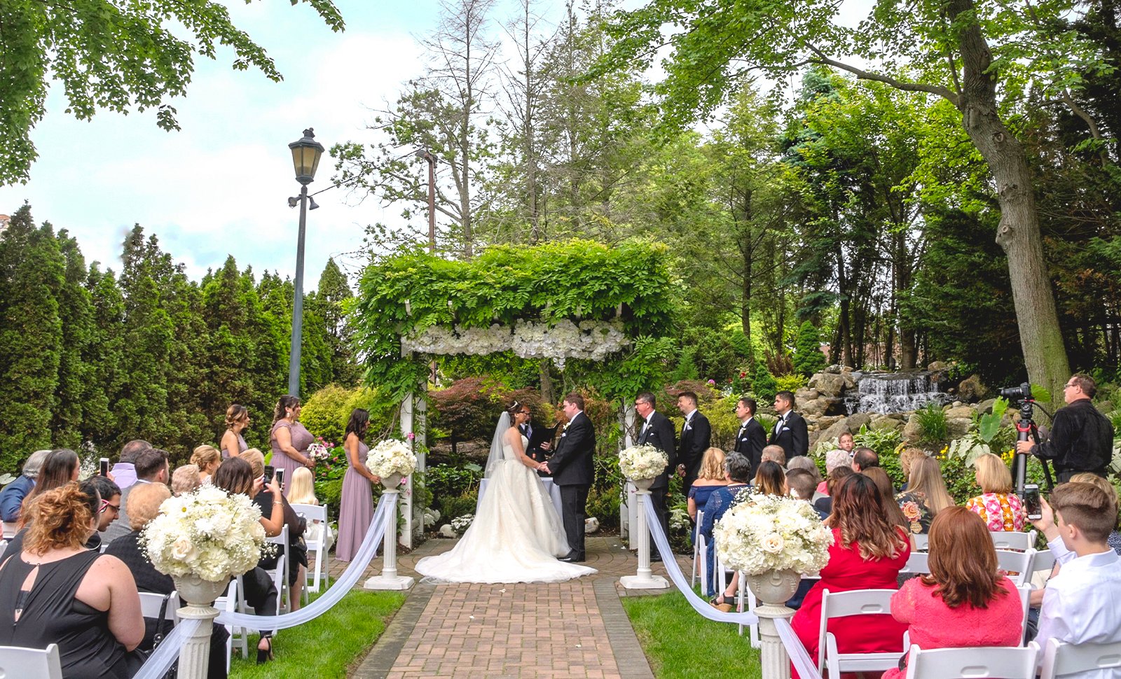 couple getting married wedding ceremony outside the fox hollow