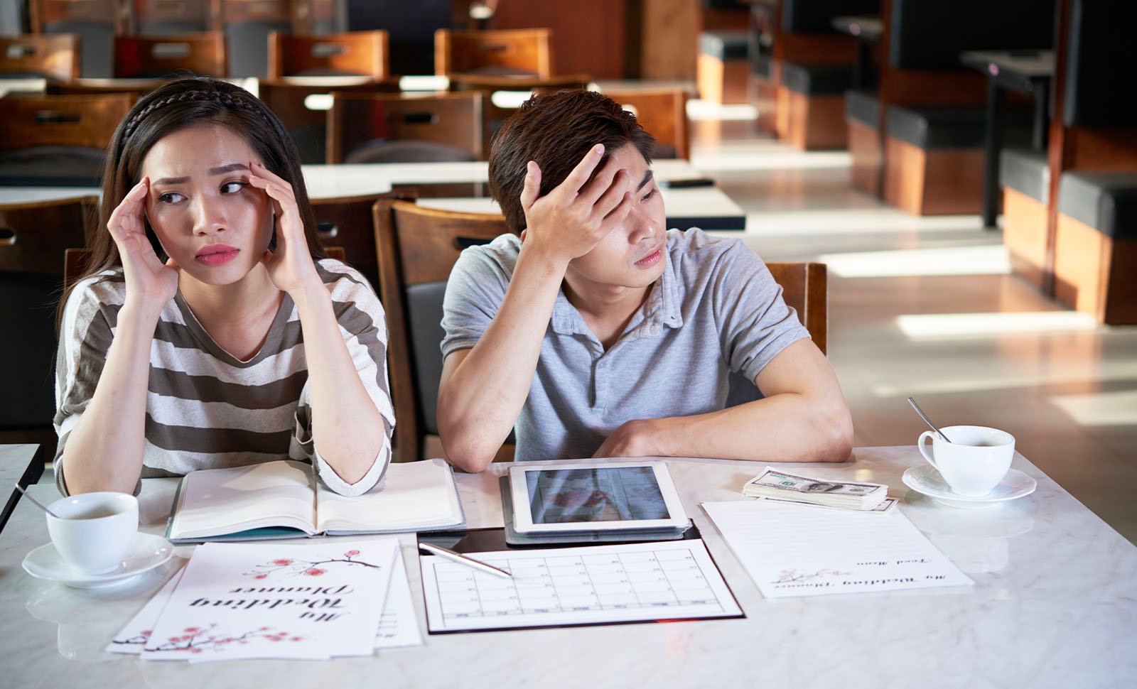 Engaged couple stressed about wedding planning